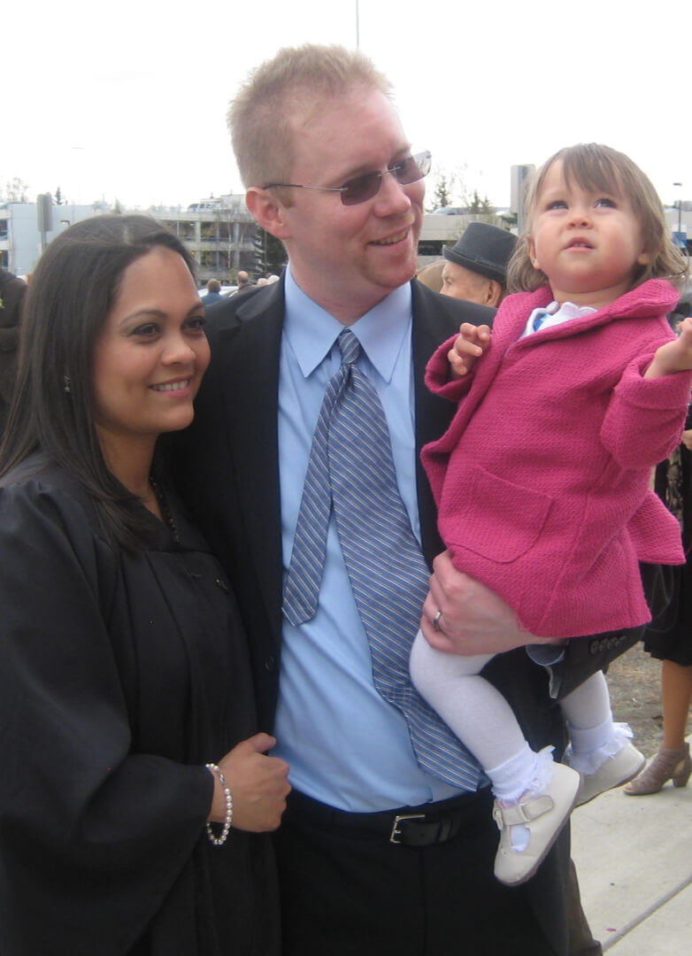 Patrick Rider, MBA, 2020, celebrates with his wife Rosa and daughter Emily after Rosa’s UAA graduation in 2017.