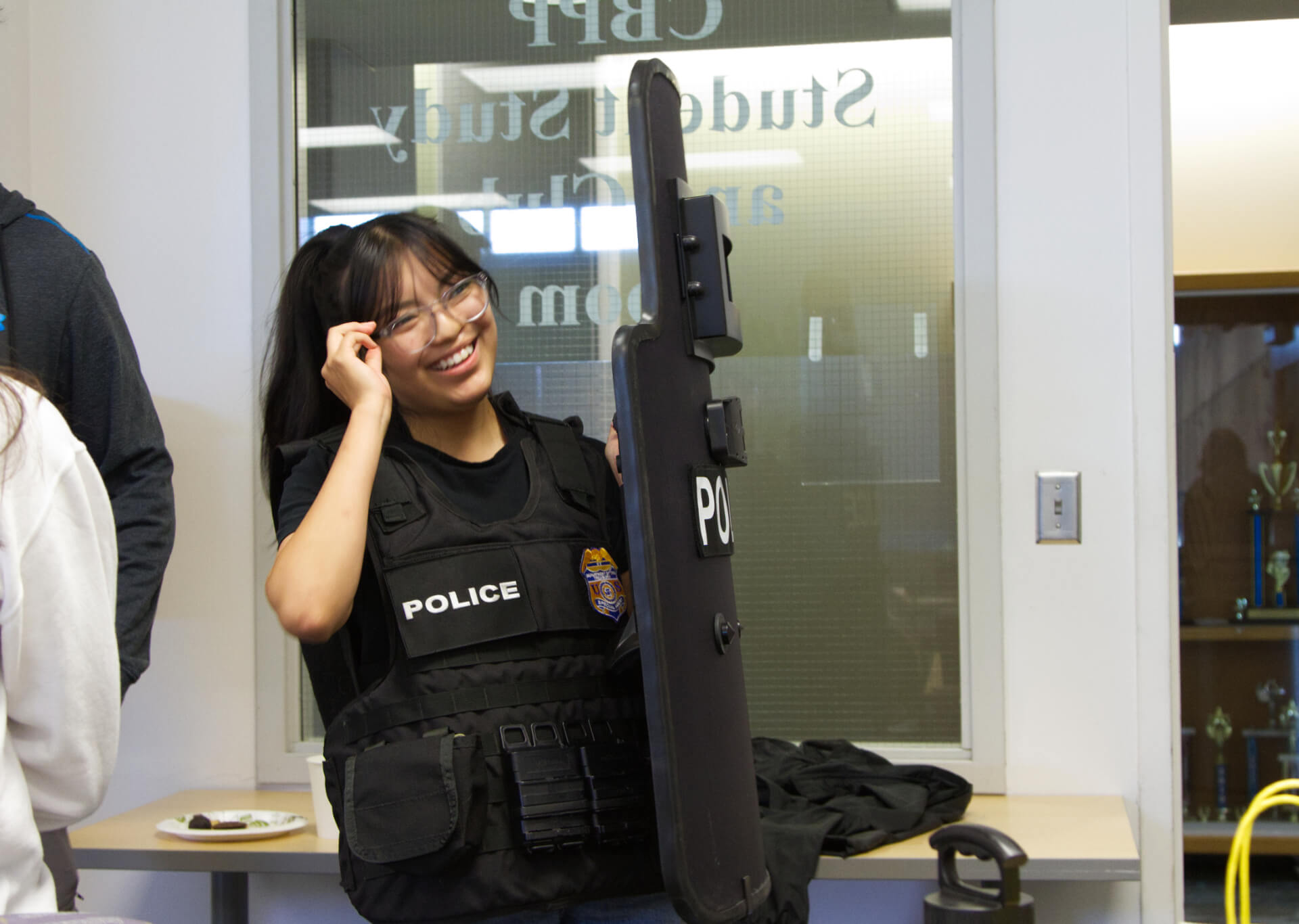 Student tries on IRS agent gear