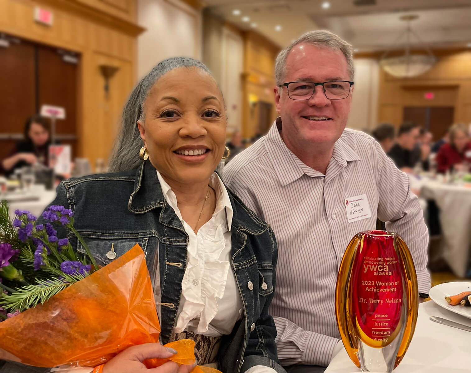 Dr. Terry Nelson, Associate Dean, and Dr. John Nofsinger, Dean, attend the December 12, 2023 YWCA Women of Achievement celebration where Dr. Nelson was honored.